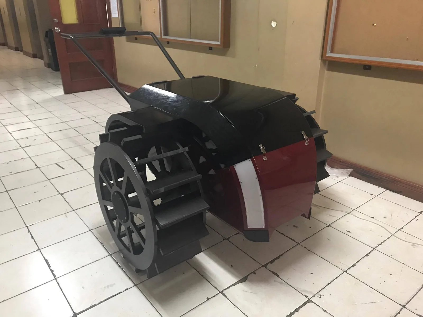 Finished physical model of the tractor with cage wheels in a hallway