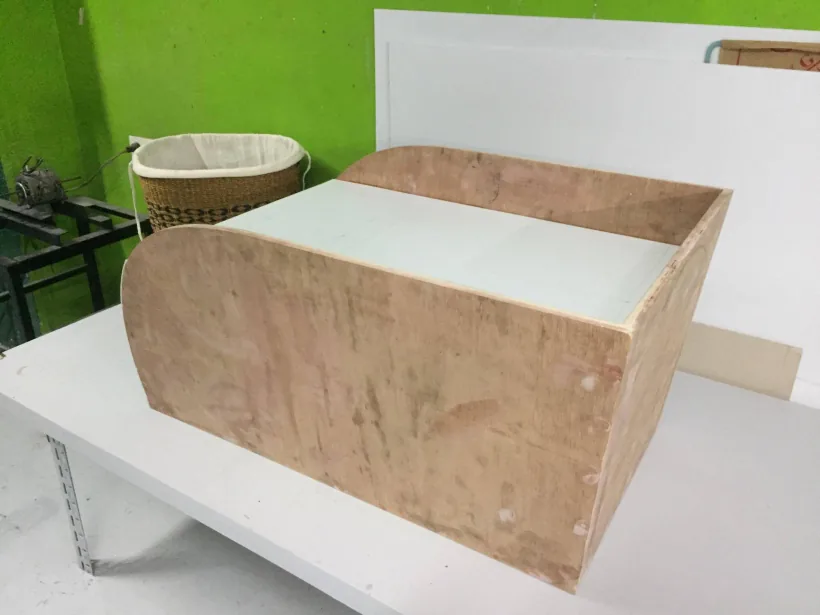 Wooden box frame for the tractor model on a workbench