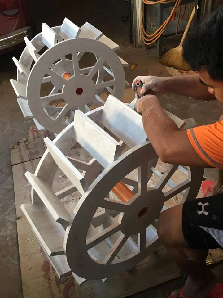 Cage wheel being assembled by hand