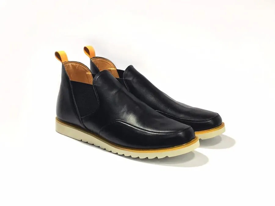 Black leather chelsea-style shoes with crepe soles