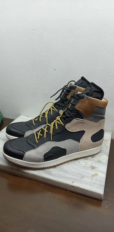 High-top in grey, navy and tan with yellow laces