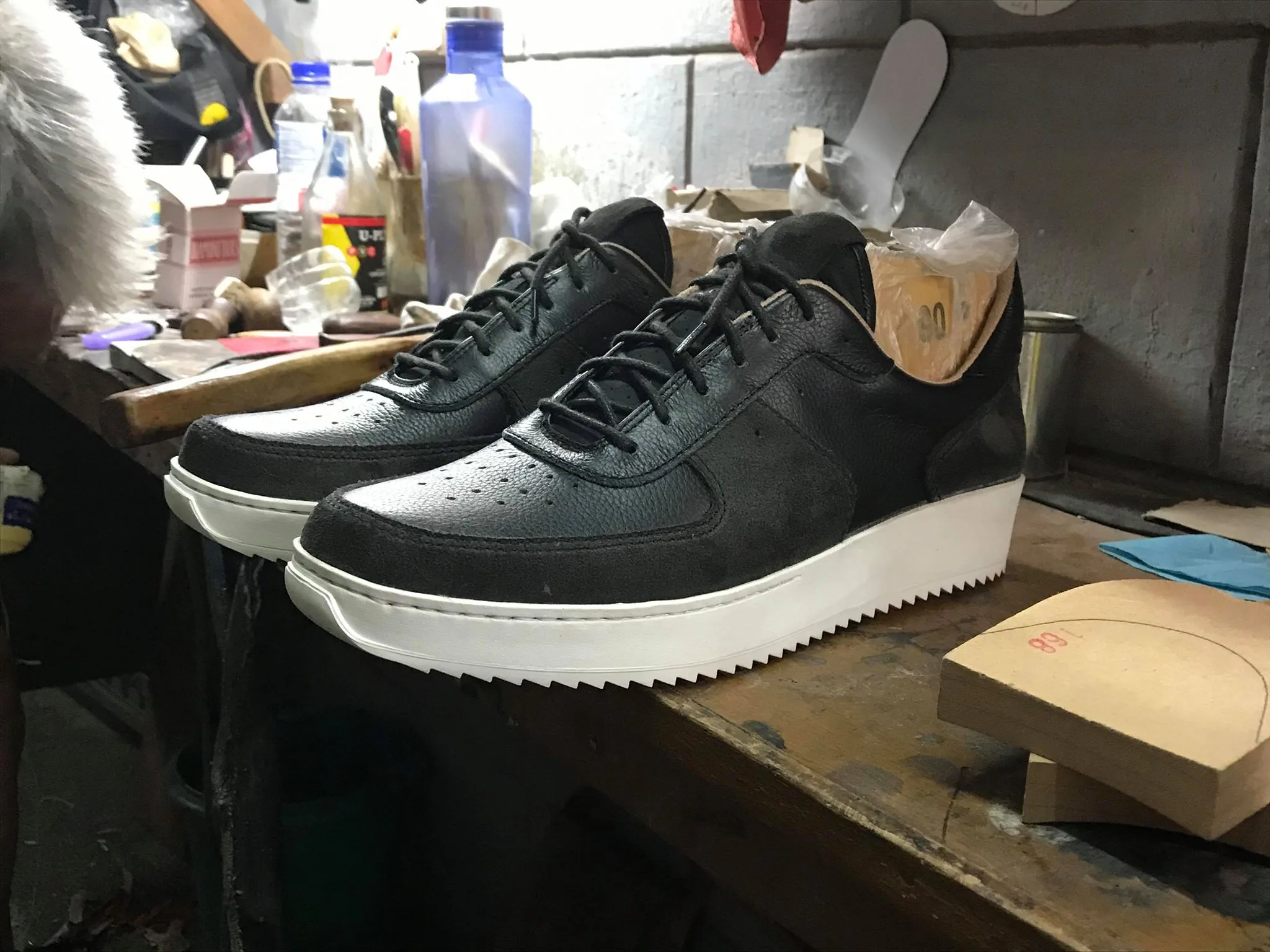 Final PAMBA prototype in black leather and suede on the workbench
