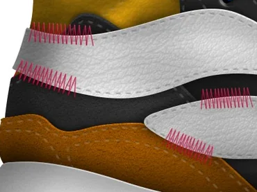 Close-up of pink zigzag stitching joining white, ochre and charcoal panels
