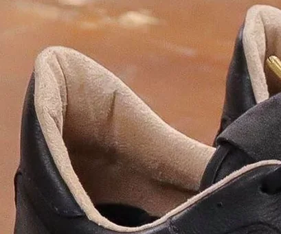 Close-up of the padded collar and tan suede lining