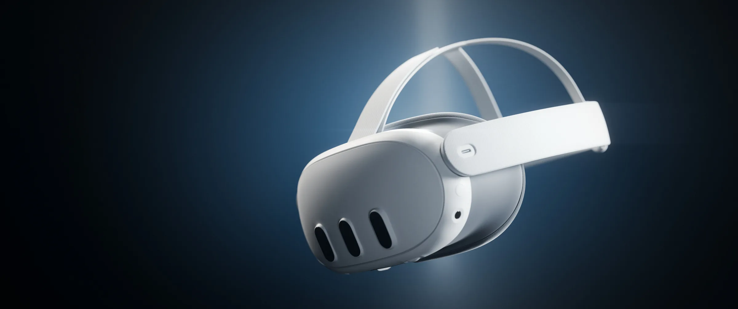Meta Quest 3 headset floating in a blue spotlight